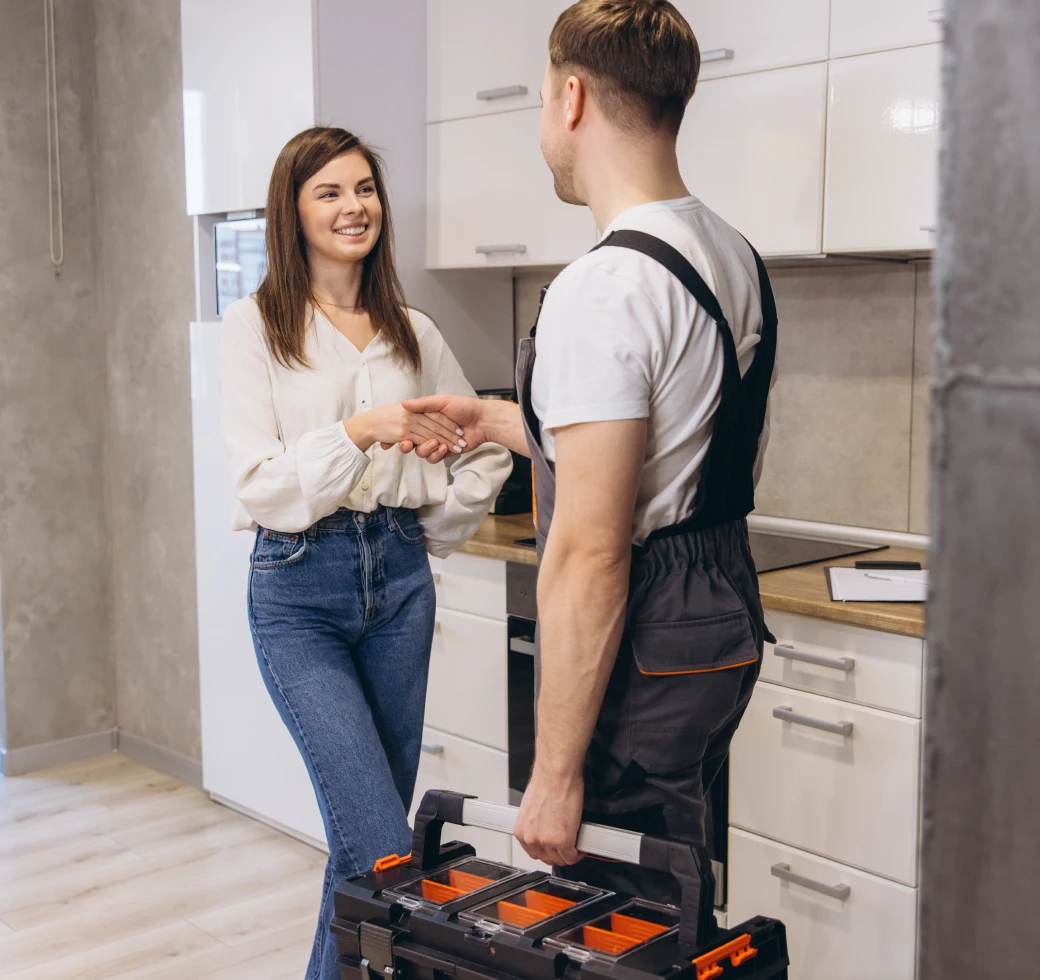Handshake with repairman holding toolbox